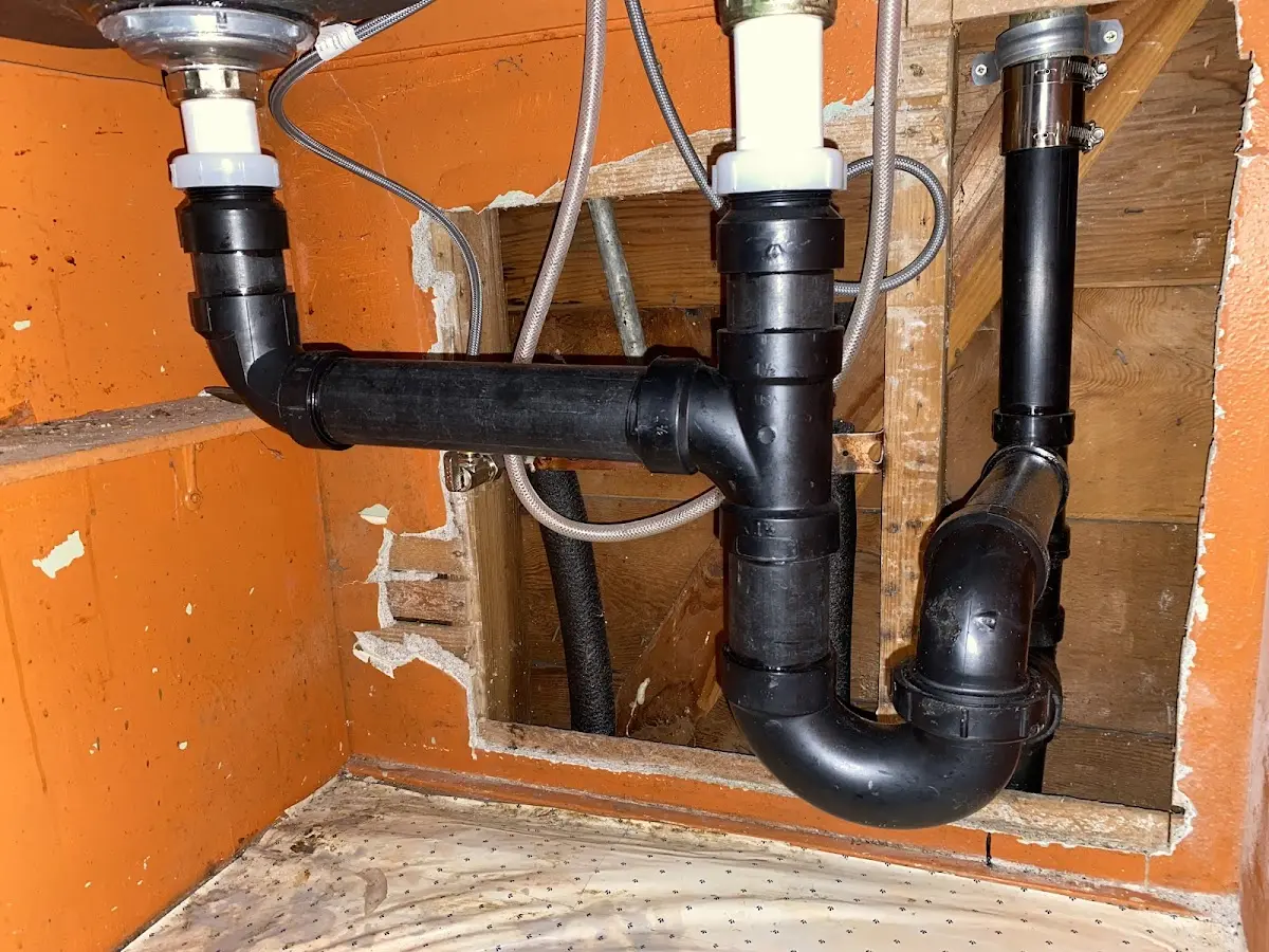 Professional Garbage Disposal Repair equipment and tools on the job in St. James